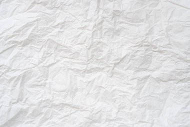 Dekoratif sanat eserlerinde arka plan dokusu için geniş kopya alanı olan tuvalet veya tuvalette kullanıldıktan sonra buruşmuş veya buruşmuş beyaz şablon kağıdı veya doku kullanılır.