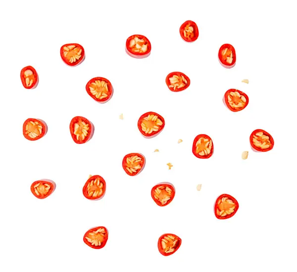 Top view set of red chili slices or pieces is isolated on white background with clipping path.