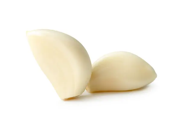 stock image Front view of peeled garlic cloves in stack is isolated on white background with clipping path.