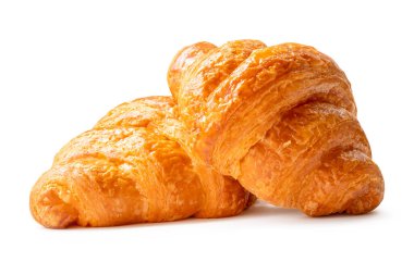 Yığındaki iki parça kahverengi ya da altın kruvasanın yan görünümü kırpma yolu olan beyaz arkaplanda izole edilmiştir..