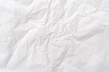 Üst görünüm ve buruşmuş beyaz kağıt dokusu dekoratif sanat eserlerinde buruşmuş beyaz kağıt arkaplan dokusu olarak kullanılır..