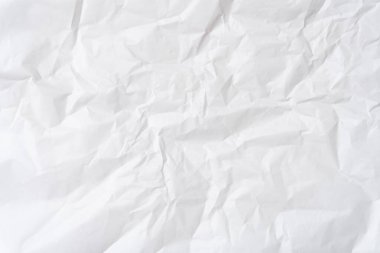 Üst görünüm ve buruşuk beyaz şablon kağıt dokusu dekoratif sanat çalışmalarında kırışık veya buruşuk beyaz kağıt arkaplan dokusu için kullanılır..
