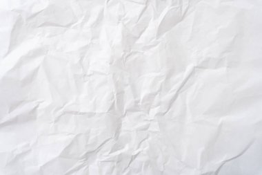 Üst görünüm ve buruşuk beyaz şablon kağıt dokusu dekoratif sanat çalışmalarında kırışık veya buruşuk beyaz kağıt arkaplan dokusu için kullanılır..