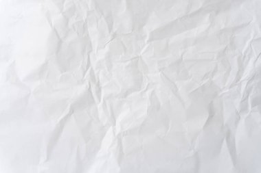Üst görünüm ve buruşuk beyaz şablon kağıt dokusu dekoratif sanat çalışmalarında kırışık veya buruşuk beyaz kağıt arkaplan dokusu için kullanılır..