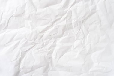 Üst görünüm ve buruşuk beyaz şablon kağıt dokusu dekoratif sanat çalışmalarında kırışık veya buruşuk beyaz kağıt arkaplan dokusu için kullanılır..