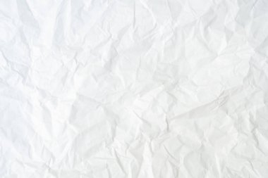 Üst görünüm ve buruşmuş beyaz kağıt dokusu dekoratif sanat eserlerinde buruşmuş beyaz kağıt arkaplan dokusu olarak kullanılır..