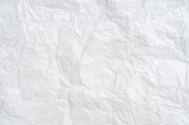 Üst görünüm ve buruşmuş beyaz kağıt dokusu dekoratif sanat eserlerinde buruşmuş beyaz kağıt arkaplan dokusu olarak kullanılır..