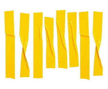 Üst görünüm, kırışık ya da buruşuk sarı yapıştırıcı bant ya da çizgili kumaş bant kümesi ufuk şeklinde izole edilmiş beyaz arka planda kırpma yolu ile.