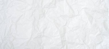 Üst görünüm ve buruşmuş beyaz kağıt dokusu dekoratif sanat eserlerinde buruşmuş beyaz kağıt arkaplan dokusu olarak kullanılır..