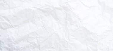 Üst görünüm ve buruşmuş beyaz kağıt dokusu dekoratif sanat eserlerinde buruşmuş beyaz kağıt arkaplan dokusu olarak kullanılır..