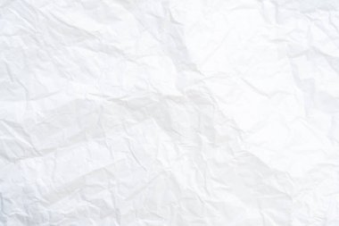 Üst görünüm ve buruşmuş beyaz kağıt dokusu dekoratif sanat eserlerinde buruşmuş beyaz kağıt arkaplan dokusu olarak kullanılır..