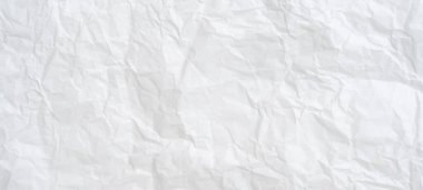 Üst görünüm ve buruşmuş beyaz kağıt dokusu dekoratif sanat eserlerinde buruşmuş beyaz kağıt arkaplan dokusu olarak kullanılır..