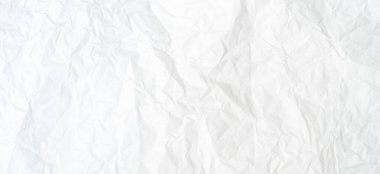 Üst görünüm ve buruşmuş beyaz kağıt dokusu dekoratif sanat eserlerinde buruşmuş beyaz kağıt arkaplan dokusu olarak kullanılır..