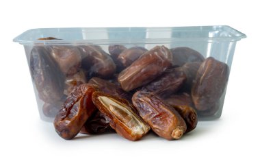 Ripe dried date palm fruits with half in stack in transparent plastic package are isolated on white background with clipping path. Concept of iftar food in Ramadan month for Muslims