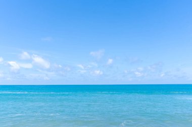 Deep blue sea with blue sky and thin fluffy clouds was taken at the sea in Phuket South of Thailand used as blue natural background texture.