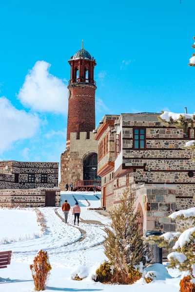 Winter landscape in historical places. Erzurum Castle and clock tower. Erzurum, Turkey