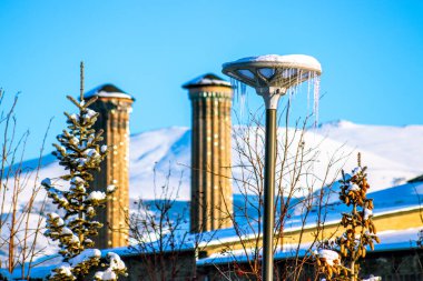 Double Minaret Madrasah or Cifte Minareli Medrese is an architectural monument , winter Landscape Erzurum Turkey. High quality photo clipart