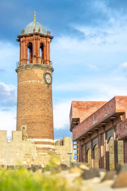 Erzurum Castle clock tower against blue sky. clipart