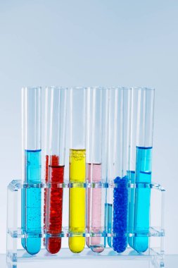 Testing tubes with colourful substances. Science research and development concept. 