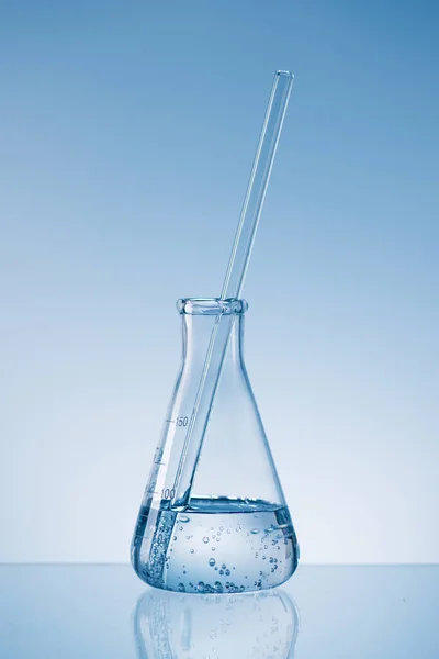 Laboratory research concept. Scientific laboratory glassware with liquid.