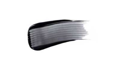 Beyaz arkaplanda izole edilmiş kömür diş macunu örneği. Tasarım için siyah kömür beyazlatma diş macunu dokusu.