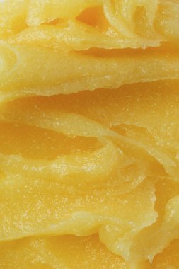 Soyut sarı şeker vücut temizleme dokusu. Vücut ya da yüz bakımı için kavun fırçası. Cilt bakımı vücut nemlendiricisi temizleyici arka plan.