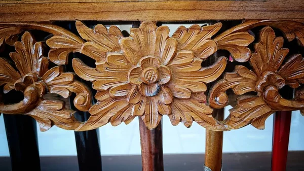 Close Up Wood Carving with typical motifs from Indonesia in the form of flowers