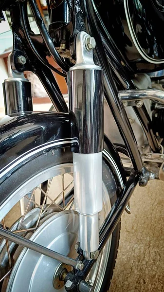 Close Up Classic Motorcycle Front Suspension or Shock with Black Cover