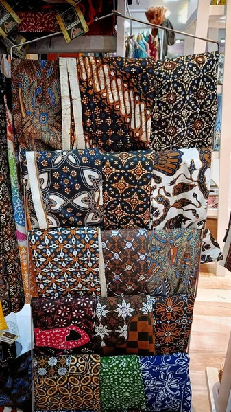 Various Batik Fabric Motifs on display at the center of the Indonesian traditional cloth market