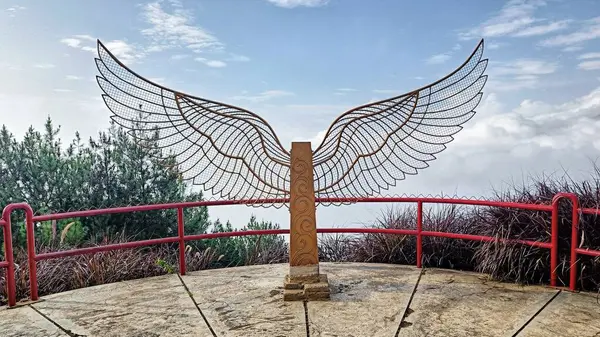 stock image Wing statue for tourism photo spot with blue sky and white clouds background