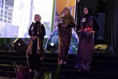 Jakarta, Indonesia - December 2022 : beautiful woman wearing an elegant batik dress, Batik is a fabric that is painted using canting and liquid wax night so as to form paintings of high artistic 