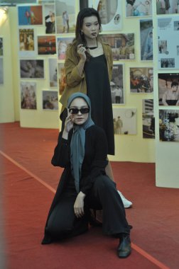 Jakarta - Oktober 01, 2022 : beautiful asian woman shopping in clothing store, shopping concept.