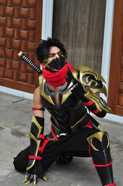 stock image Jakarta, Indonesia - October 29, 2022 : Portrait of Cosplayer as Hayabusa, a fictional character from Mobile Legends Game at cosplay event. 