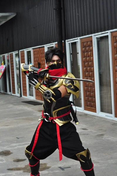 stock image Jakarta, Indonesia - October 29, 2022 : Portrait of Cosplayer as Hayabusa, a fictional character from Mobile Legends Game at cosplay event. 