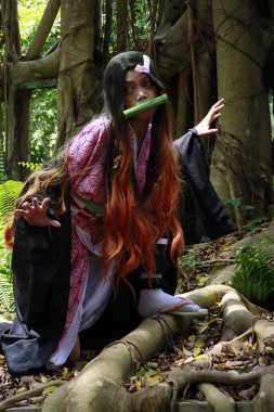 Banjarmasin, Endonezya - 25 Haziran 2023: Cosplayer as Character Nezuko Kamado, Demon Slayer 'da canlandırılabilir bir karakterdir.