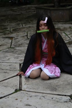 Banjarmasin, Endonezya - 25 Haziran 2023: Cosplayer as Character Nezuko Kamado, Demon Slayer 'da canlandırılabilir bir karakterdir.