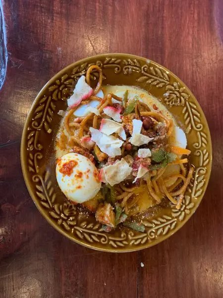 stock image Lontong Sayur Medan, Traditional Indonesian Food from Medan, North Sumatra,  Compressed Rice Cake or Lontong with Chayote and Long Beans Cooked in and Spices, Coconut broth with vegetables, egg.