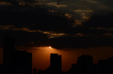 image of the mysterious sunset at the end of the day right after a rain
