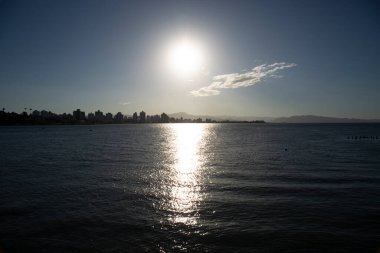 reflection of the sun under the bay in a Brazilian city in a beautiful and pleasant morning