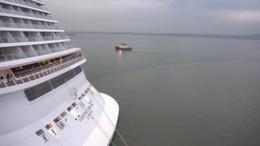 Surabaya, East Java, Indonesia - December 20, 2022 : Genting Dream Cruise Ship at Tanjung Perak Harbor, Surabaya. the tourists are very happy to travel around the city. the ship ready to depart