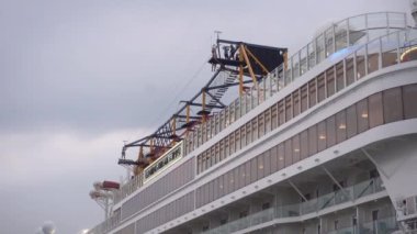 Surabaya, East Java, Indonesia - December 20, 2022 : Genting Dream Cruise Ship at Tanjung Perak Harbor, Surabaya. the tourists are very happy to travel around the city. the ship ready to depart