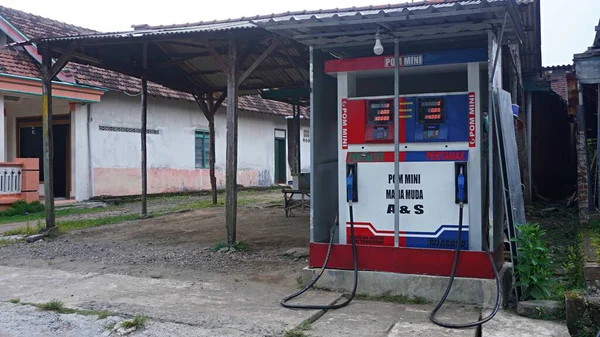 Surabaya, East Java, Indonesia -January, 2023 : Mini fuel gasoline station of premium, pertalite, pertamax Infront of the house usually called Pertamini or PERTAMINA mini        