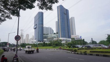 Surabaya, East Java, Indonesia - February, 2023 : Four Point Hotel by Sheraton tower building in the PTC Pakuwon Trade Center mall with beautiful cloud sky background                   