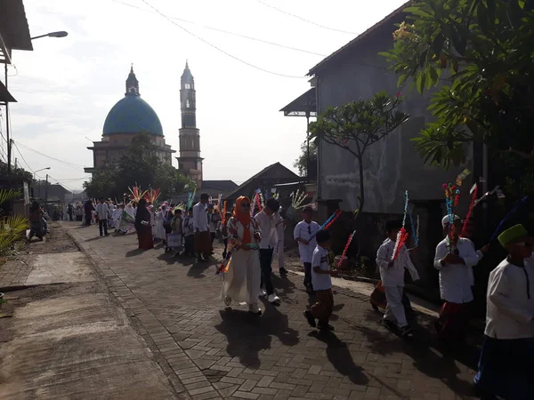 Surabaya, East Java, Indonesia - February, 2023 : Selective focus Elementary school children's parade in commemoration of the Prophet Muhammad's Isra and Miraj
