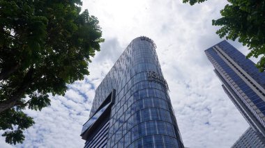 Surabaya, East Java, Indonesia - February, 2023 : Four Point Hotel by Sheraton tower building in the PTC Pakuwon Trade Center mall with beautiful cloud sky background   