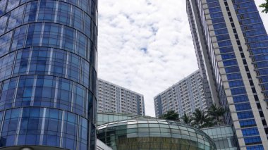 Low angle high Tower building with beautiful cloud sky background in Surabaya  