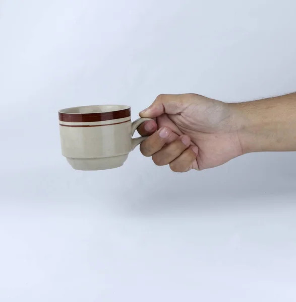 Hand Hält Ein Glas Tasse Auf Weißem Hintergrund — Stockfoto