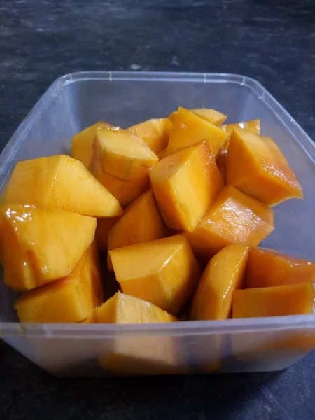 mango slices served in a plastic container