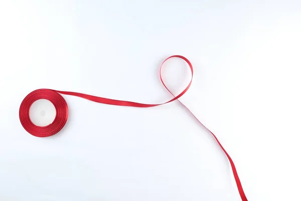 stock image Red Support Ribbon isolated on white background. World aids day and national HIV/AIDS and aging awareness month with red ribbon. copyspace area