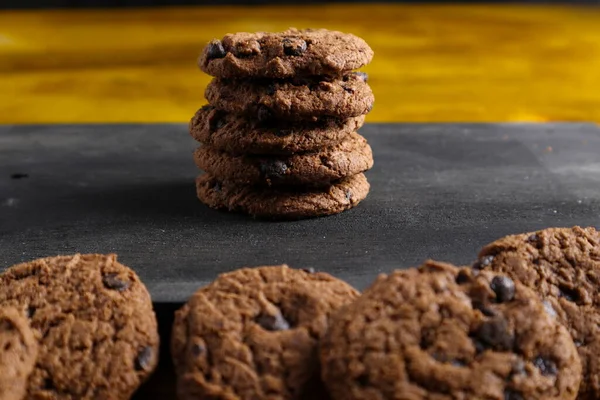 Chocolate chip cookies on wooden background